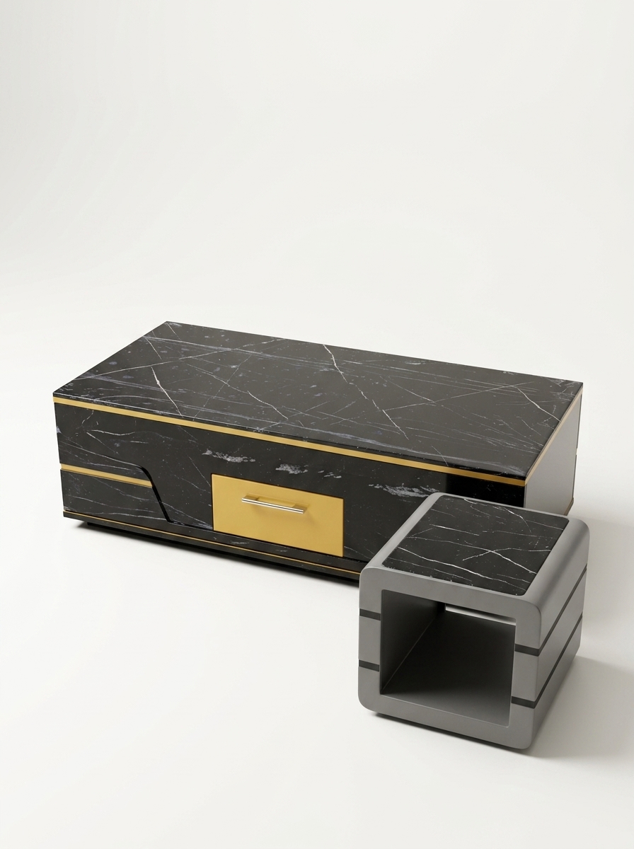 Low rectangular coffee table from Kenya with dark veined marble top, gold-toned trim and drawer, beside a grey cube side table